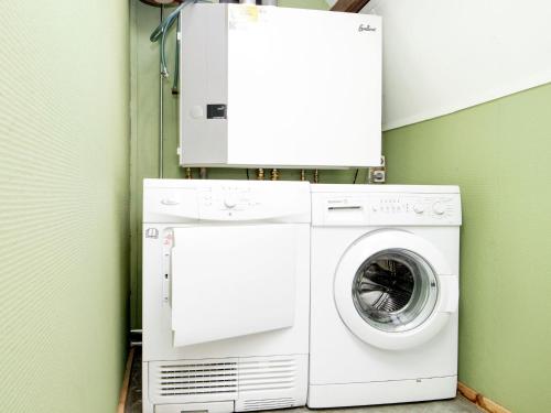 a washer and dryer in a green room at Cottage in Leenderbos near Nature Reserve in Leende
