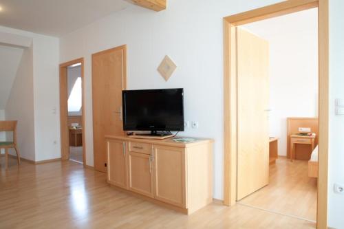 TV a/nebo společenská místnost v ubytování Raiffeisenhof Appartements