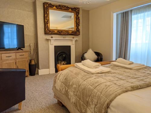 Un ou plusieurs lits dans un hébergement de l'établissement Sparkford Inn