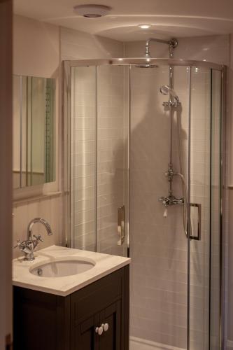 a bathroom with a sink and a shower at The Studio in Castle Bytham