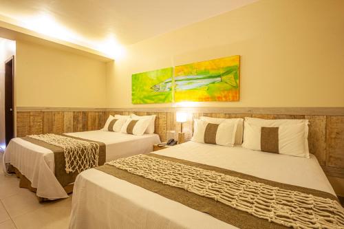 Ocaporã Hotel All Inclusiveにあるベッド