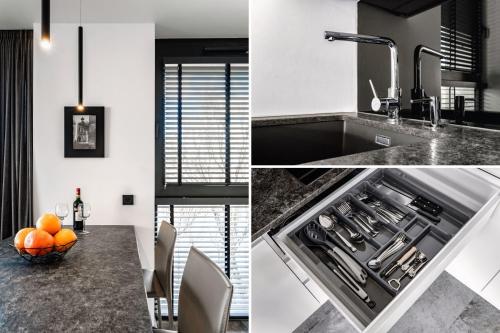a kitchen with a sink and a bowl of oranges on a counter at PLATiNIUM RESIDENCE&SPA BASEN-SAUNA "BEST VIEW" CENTER in Lublin