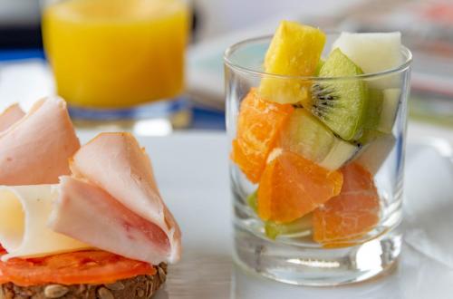 a glass cup filled with fruit on a table at Hotel J. Balmes Vic in Vic