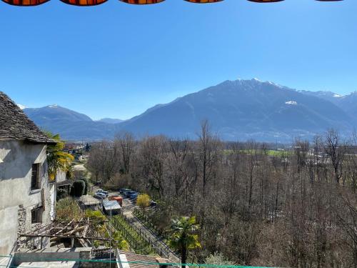 a view of a town with mountains in the background at CASA PONTE: Gordola in Gordola