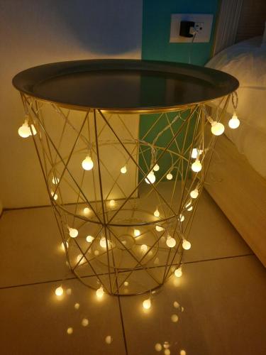 a bunch of lights hanging from a ceiling at 3Kiss Homestay in Wujie