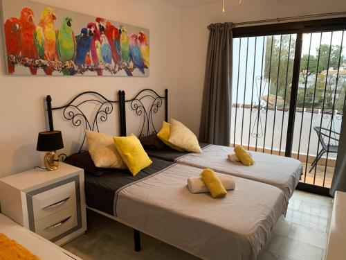 A bed or beds in a room at Maison Mijas Costa