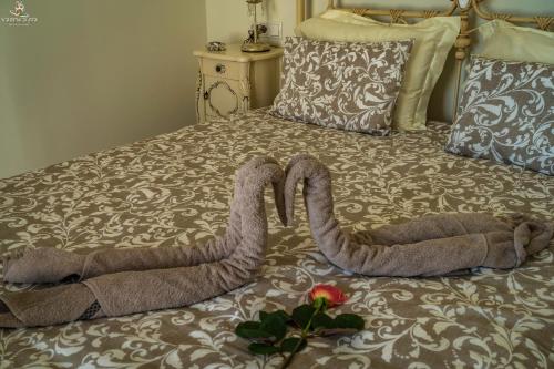 Tempat tidur dalam kamar di Villa Nikki