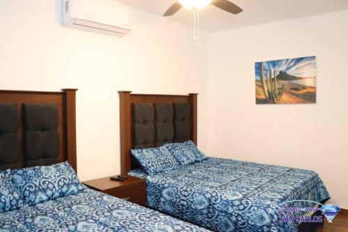 En eller flere senge i et værelse på Departamento Topacio 1 Joyas del Mar