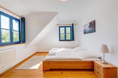 Postel nebo postele na pokoji v ubytování Am Achterwasser DORF 12