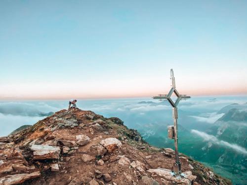 a cross on the top of a mountain at SchönBerg hotel b&b in Rio Bianco
