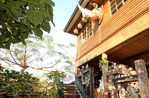 a building with a fence in front of it at Taichung Xinshe Garden Life Homestay B&B in Xinshe