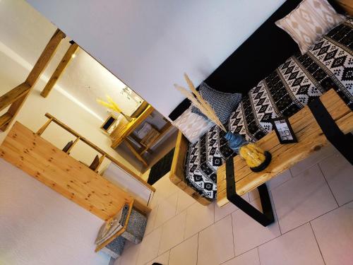 an overhead view of a living room with a table at Spongia Apartments Kalymnos in Kalymnos