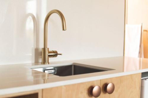 a kitchen with a stainless steel kitchen sink at Matawhero Wines in Gisborne