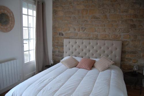 Ένα ή περισσότερα κρεβάτια σε δωμάτιο στο POISSY Appartements COSY