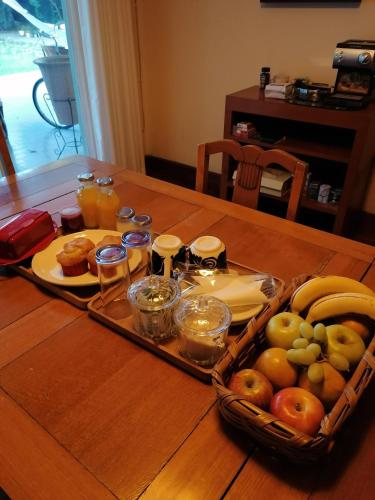 a tray of food on a table with fruit at Casa de Luz in Guadalajara