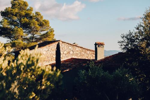 a building with a chimney on top of it at Domaine Monte Verdi in Flayosc