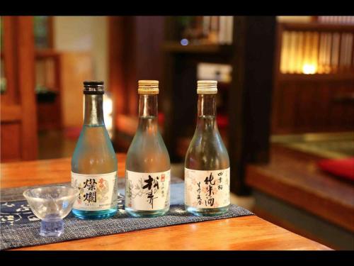 three bottles of wine sitting on top of a table at Oyado Ichifuji in Nikko