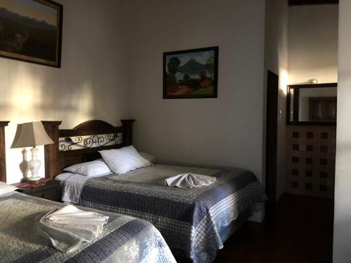 Cama o camas de una habitación en Dionisio Inn