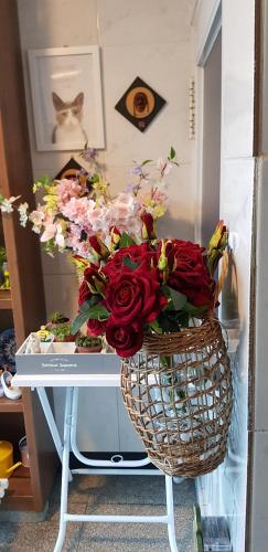 a vase filled with flowers on a table at Naksanstay in Yangyang