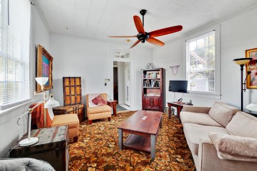 a living room with a couch and a ceiling fan at Bywater Home, Parking and Pet Friendly Retreat in New Orleans