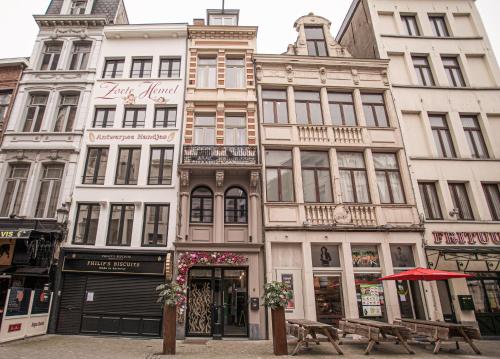 a large building in the middle of a street at Luxury Suits Historic Center in Antwerp