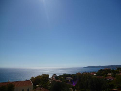 a view of the ocean from a city at Marinos Studios at Lourdata village in Lourdhata