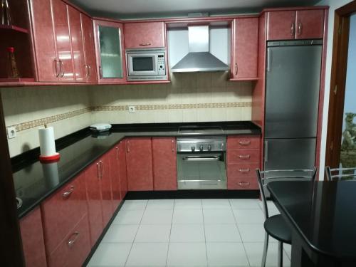 Una cocina o zona de cocina en Vivienda compartida Tajaraste