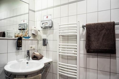 Ett badrum på Garni Hotel & Appartements Nordstrand