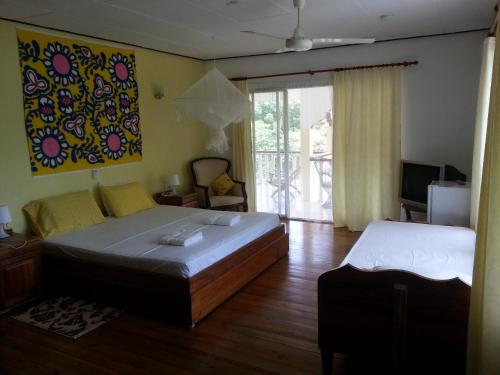 Ένα ή περισσότερα κρεβάτια σε δωμάτιο στο Zanboza Guesthouse