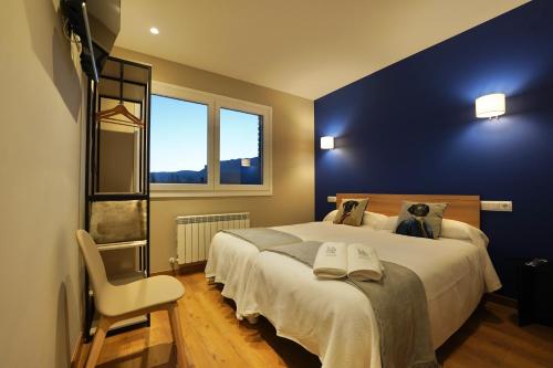 Postel nebo postele na pokoji v ubytování Larrion Hostal - Ostatua
