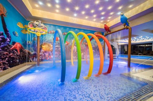 a pool with a water park with a water slide at Park & Spa Hotel Markovo in Plovdiv