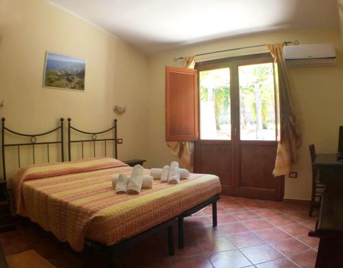 Postel nebo postele na pokoji v ubytování Hotel Sant'elene