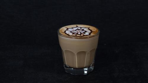 a drink with a snowflake on the top of it at Ayani Hotel Banda Aceh in Banda Aceh