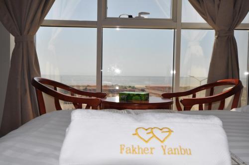 a hotel room with a bed with a pillow with a valentine sign on at Fakher Yanbu 3 Furnished Units in Yanbu