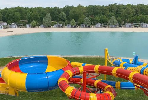 a water park with a colorful water slide at ZEN-bungalow NO 1 met sauna en hottub in Rheezerveen