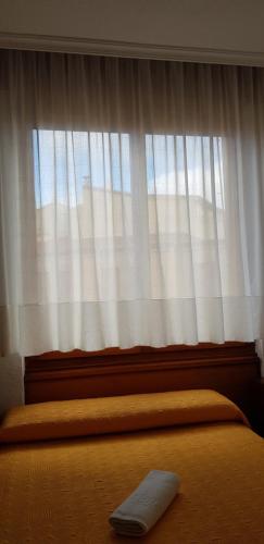 Letto o letti in una camera di Pension Salamanca