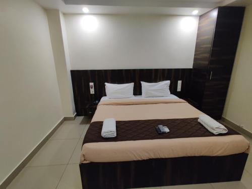 Katil atau katil-katil dalam bilik di Venkateshwara Mitra Residency