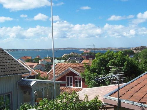 a view of a town with roofs and a body of water at 2 person holiday home in LYSEKIL in Lysekil