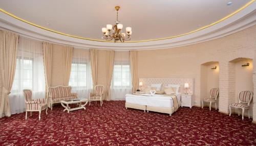
a large room with a large bed and a large window at Hotel Maroseyka 2/15 in Moscow
