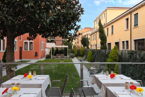 a view of a courtyard with tables and chairs at Carnival Palace - Venice Collection in Venice