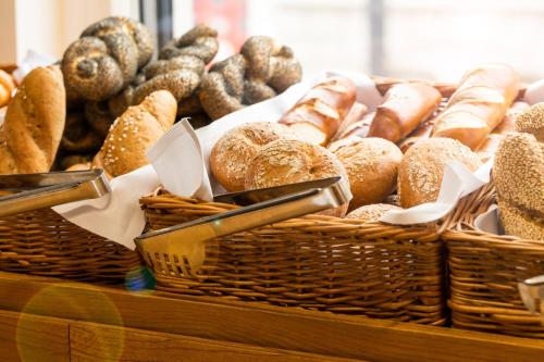 a display of breads and pastries in a bakery at Hotel Zeitgeist Vienna Hauptbahnhof in Vienna