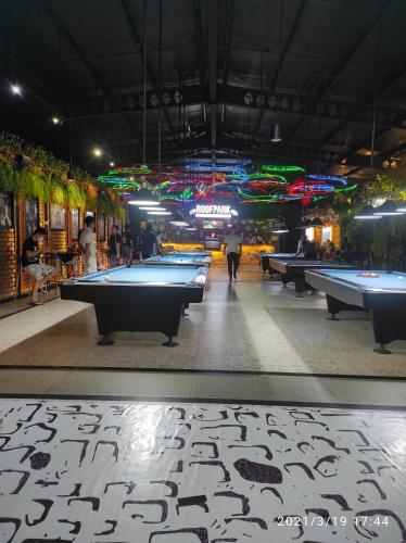 a pool hall with billiard tables in it at Villa kota bunga 3 BR Kolam renang pribadi in Cipanas