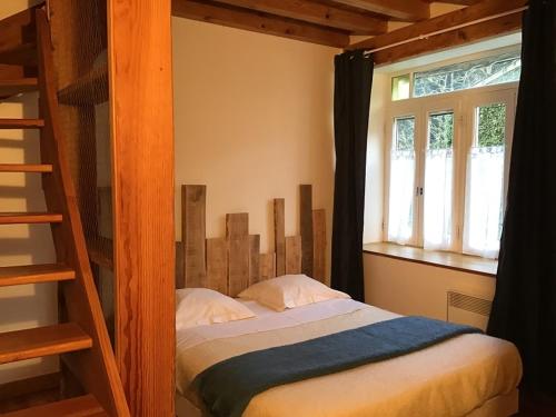 a bedroom with two bunk beds and a ladder at Au mohair des Alpy in Fougax-et-Barrineuf