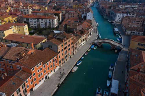 an aerial view of a river in a city at Carnival Palace - Venice Collection in Venice