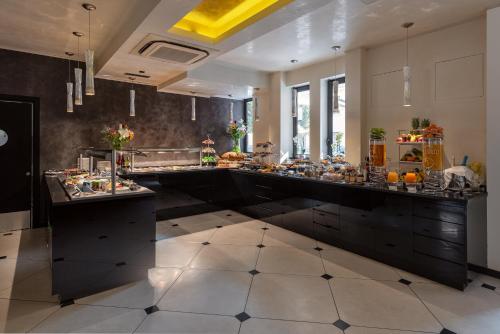 a kitchen with a long counter with food on it at Carnival Palace - Venice Collection in Venice