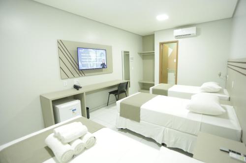 En eller flere senge i et værelse på Valen Porto Hotel São Luís