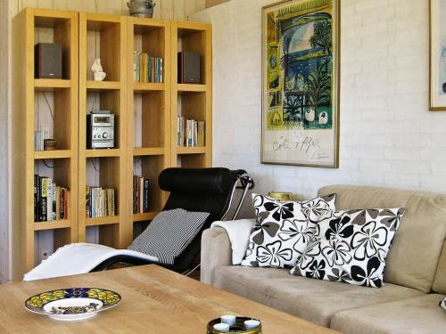 a living room with a couch and a table at Seaside Escape in Praesto - By Traum Ferienwohnungen in Mosebølle