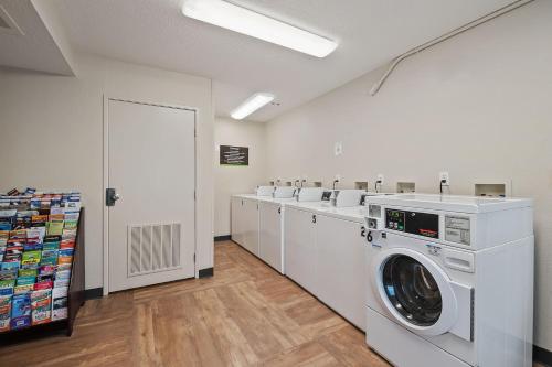 a laundry room with a washer and dryer at Extended Stay America Suites - Miami - Airport - Blue Lagoon in Miami