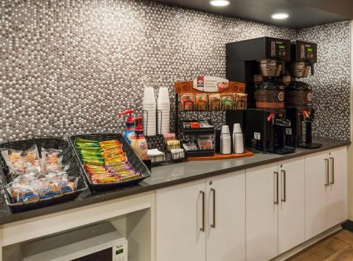 a counter with food and drinks on it at Extended Stay America Suites - Miami - Airport - Blue Lagoon in Miami