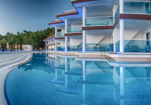 a large swimming pool in a hotel room at Garcia Resort & Spa - Ultra All Inclusive in Oludeniz